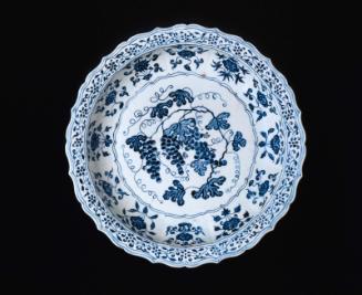 Large plate with blue-and-white decoration of  grapevine and flowers