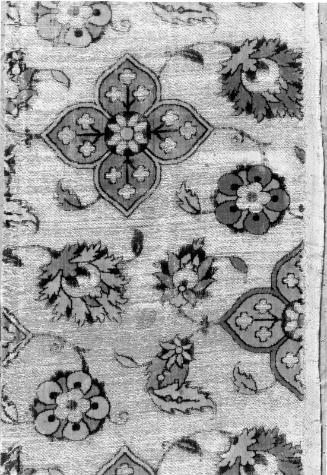 Fragment with palmettes, leaves, and floral quatrefoils