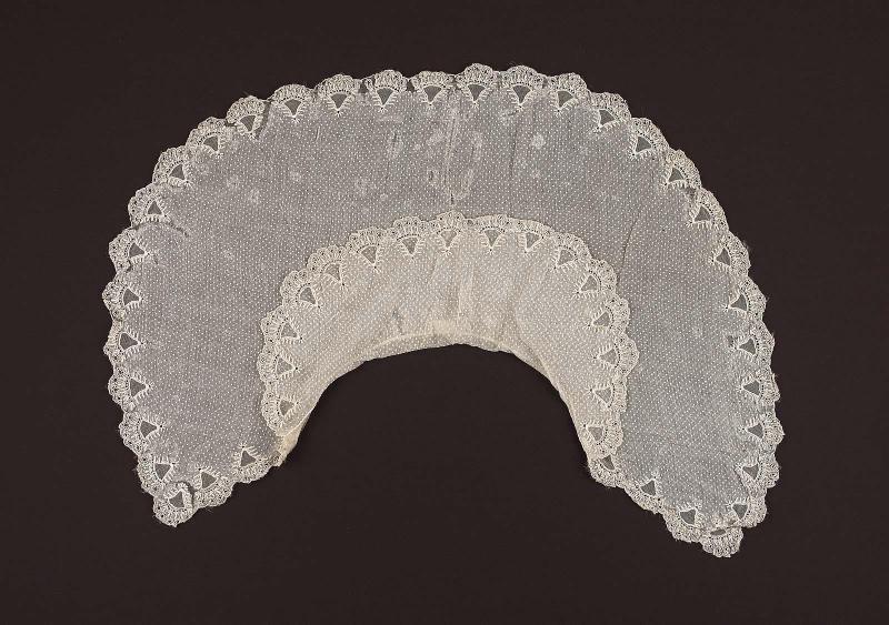 A white dotted Swiss double cape