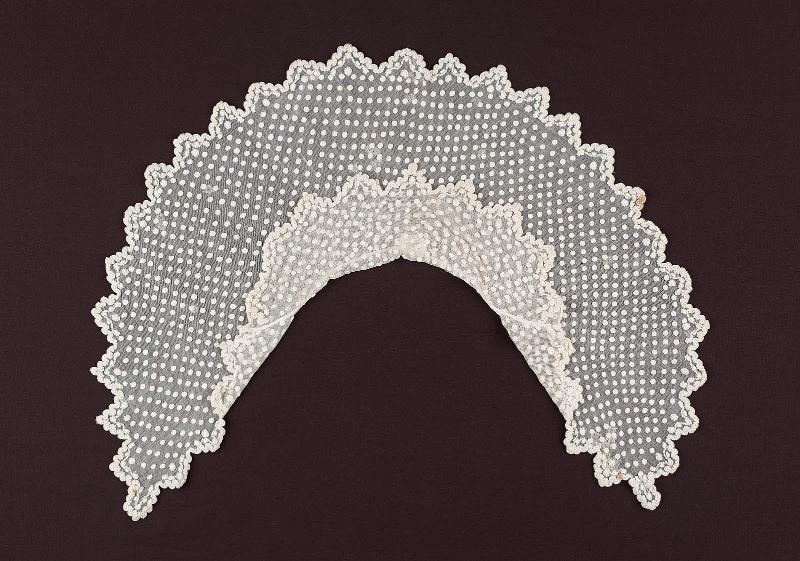 A small white cotton gauze double cape