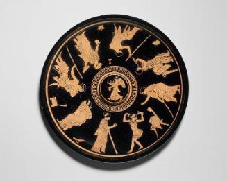 Libation bowl (phiale mesomphalos) depicting men being entertained