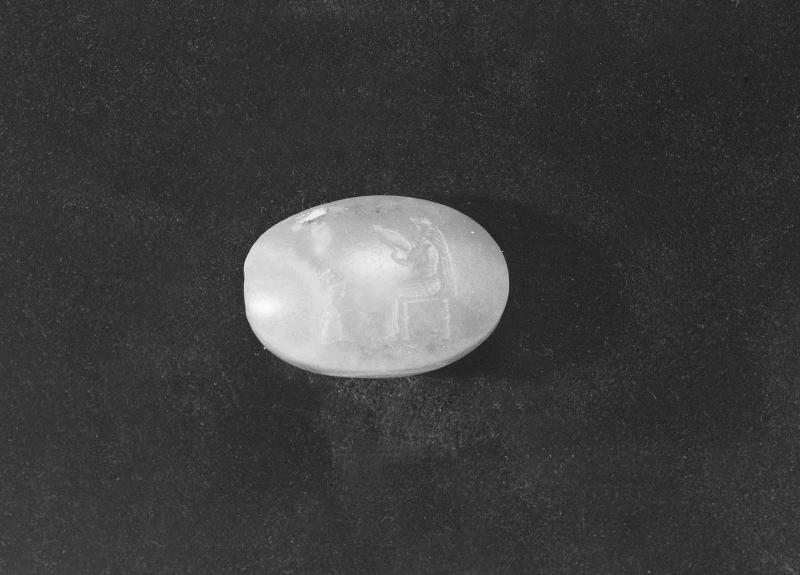 Scaraboid gem with seated woman