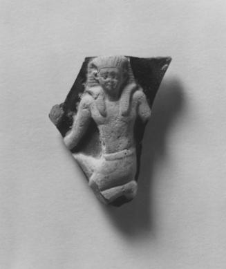 Vessel fragment kneeling Egyptian figure