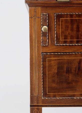 Fluted column and inlay on left side of desk