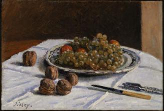 Grapes and Walnuts on a Table