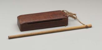 Slit drum (bang) and mallet