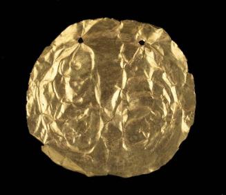 Embossed gold disk