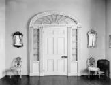 Inside casing of front door; the panelled door is a modern replacement