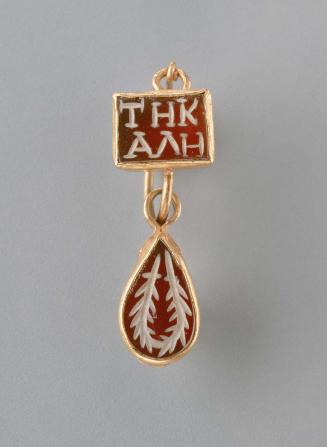 Earring with inscribed gemstone