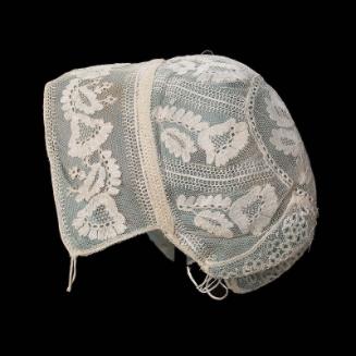 Infant's cap of embroidered net