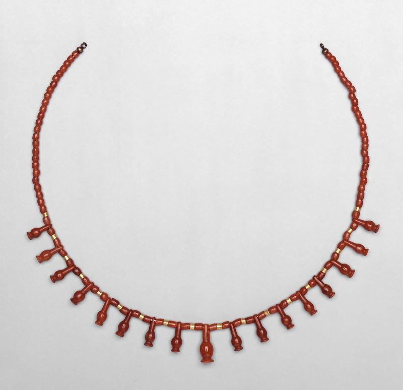 String of cornflower pendants and assorted beads