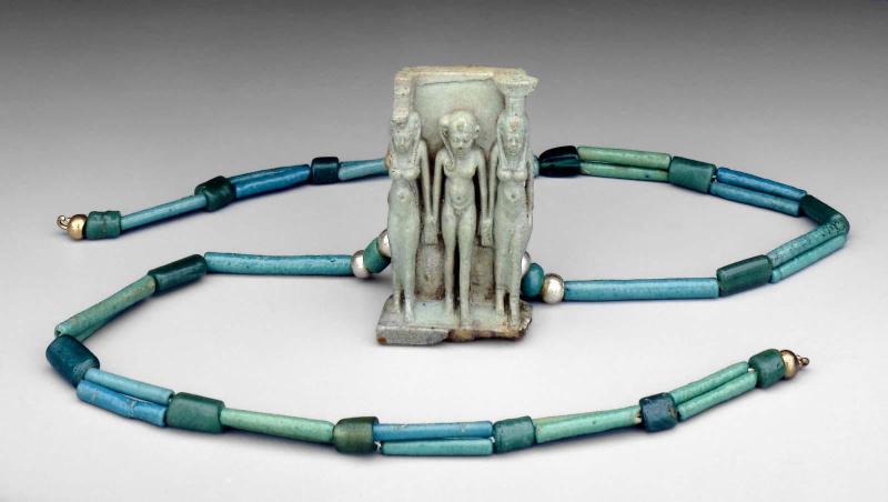 String of assorted beads with triad pendant