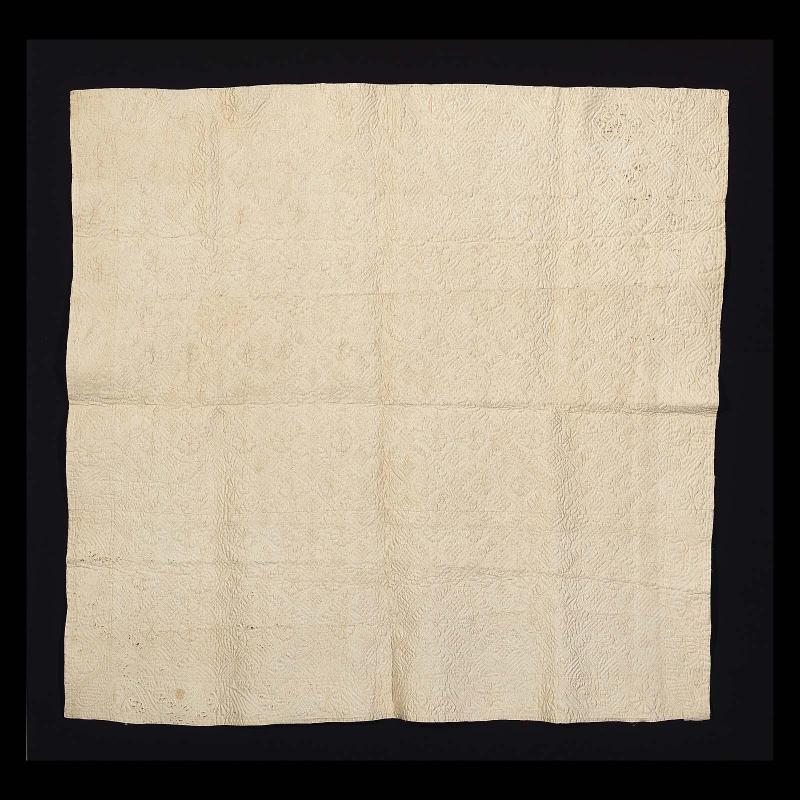 Infant's quilted blanket and pair of sleeves