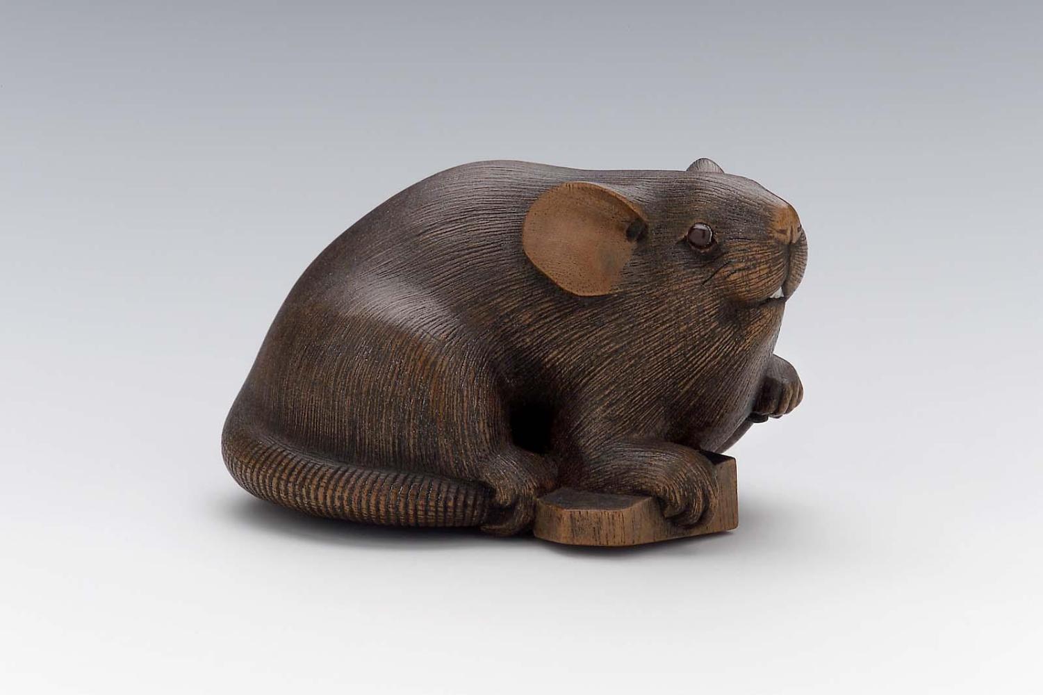 Rat with its paw on a shogi piece