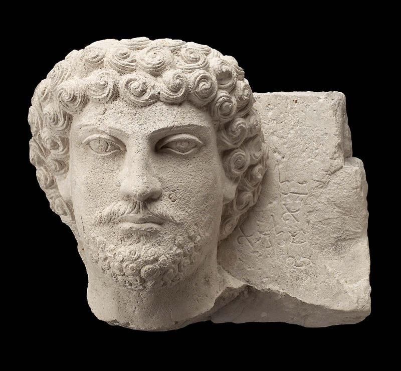 Tomb relief with the head of a bearded man