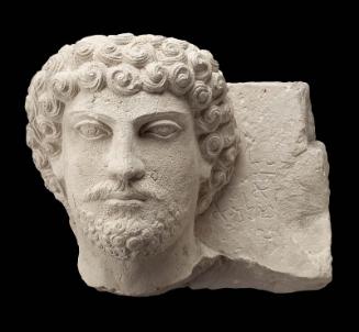 Tomb relief with the head of a bearded man