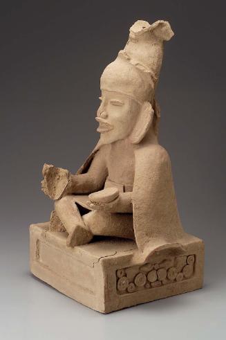 Seated human effigy