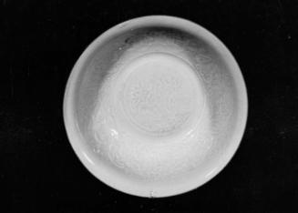 Molded bowl with relief designs under qingbai glaze
