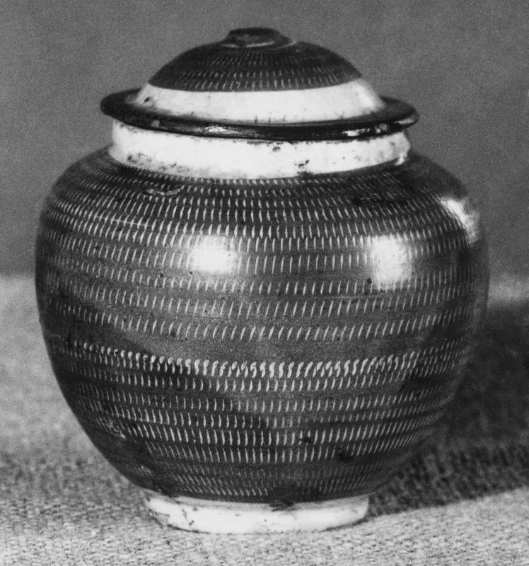 Covered jar with chatter marks