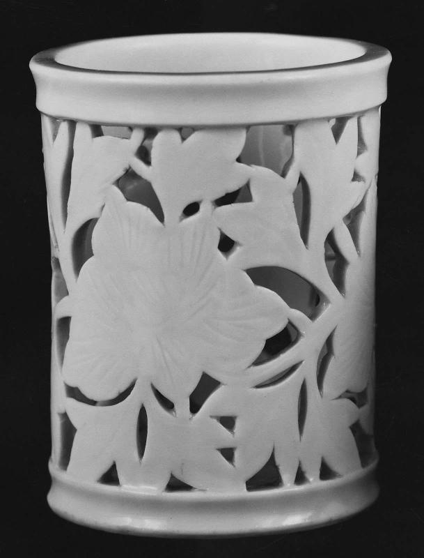 Reticulated brush holder