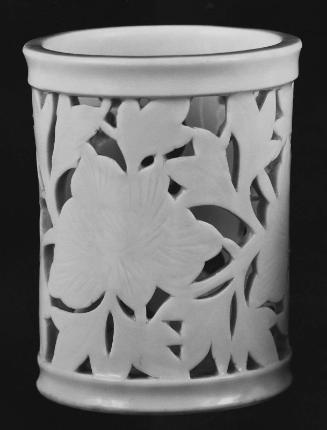 Reticulated brush holder