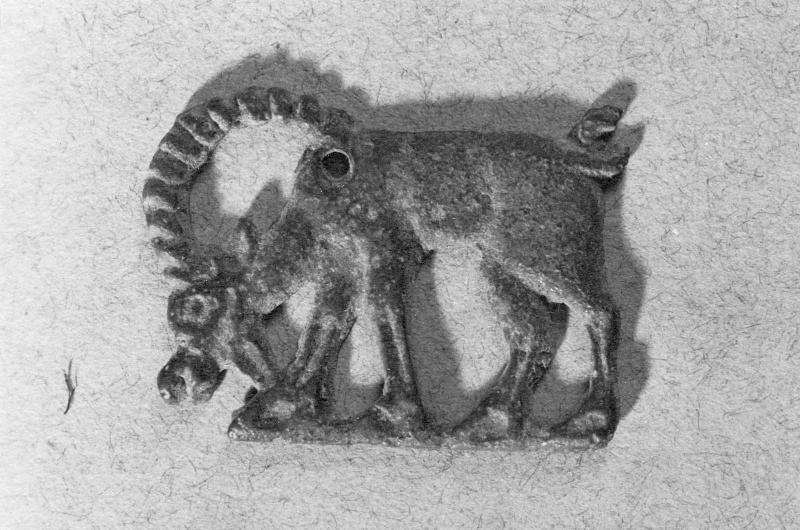 Ornament in the form of a grazing ibex