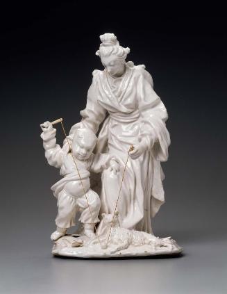 Lady with a child and a cat playing with a string toy