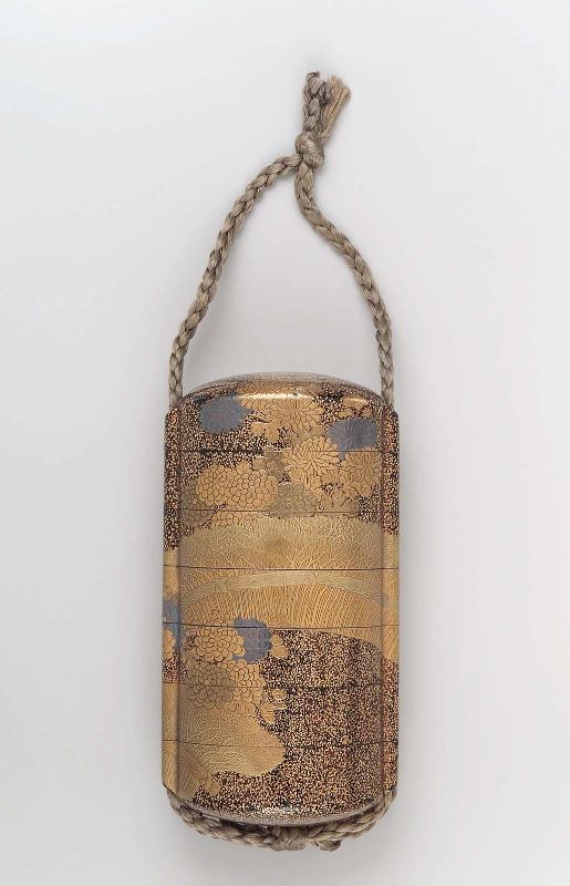 Six-case inro with design of chrysanthemums by a brushwood fence