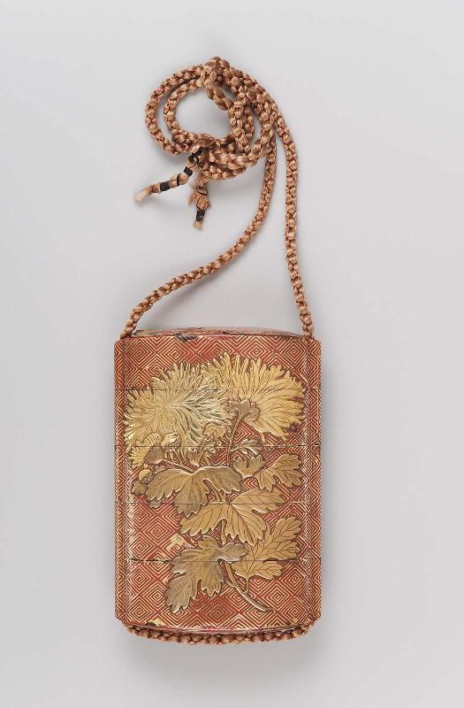 Four-case inro with peony design on a geometric background