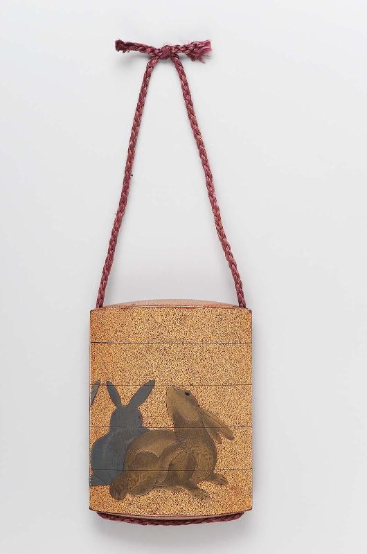 Four-case inro with design of hares and tokusa (scouring rushes)