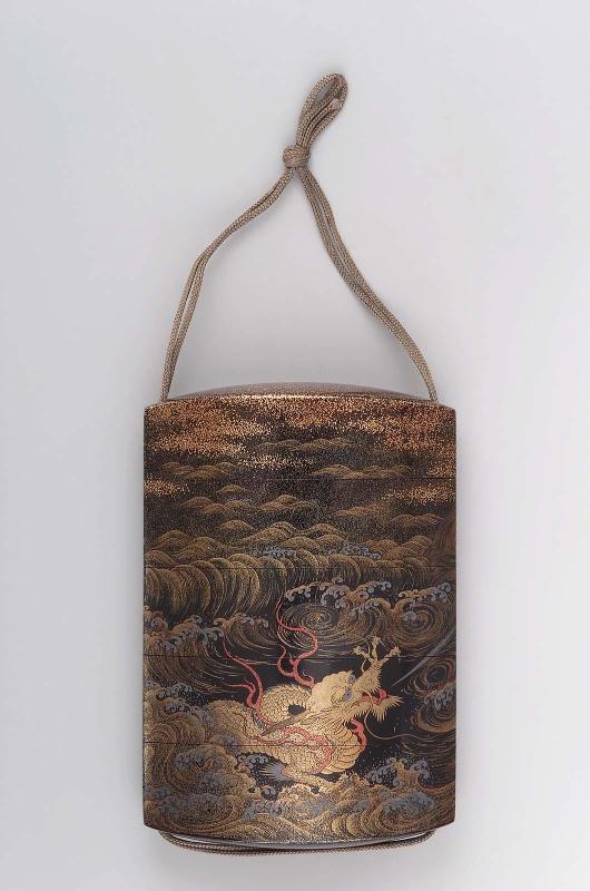 Four-case inro with dragon and waves design