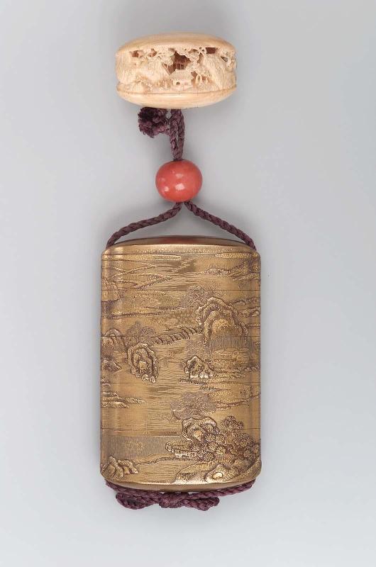 Netsuke in the form of a clam opening to reveal a landscape design