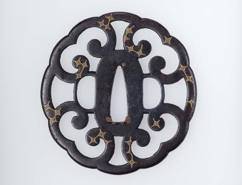 Tsuba with design of fern fronds and star motifs