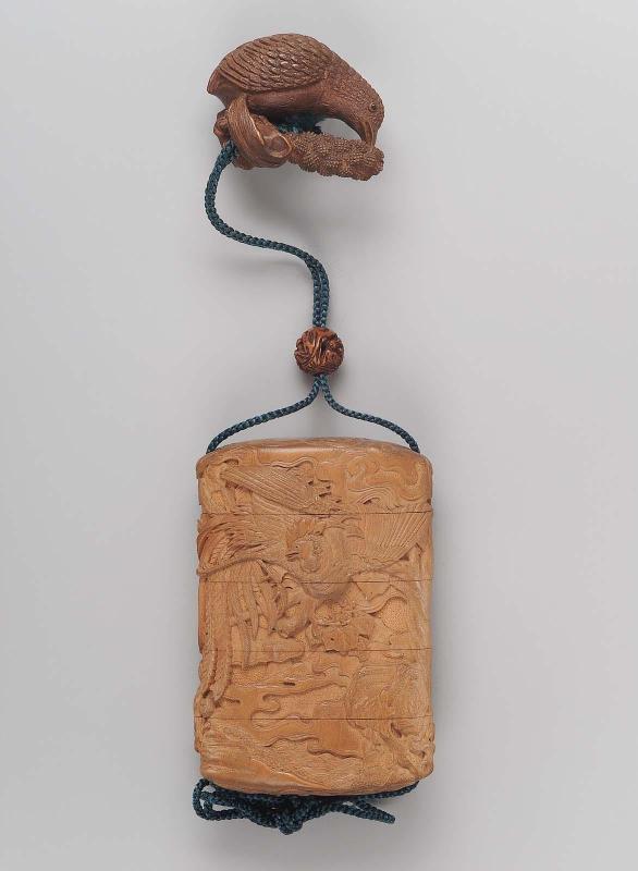 Ojime carved with Chinese scholars in a rocky landscape