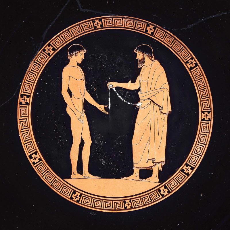 Drinking cup (kylix) depicting victorious athletes and judges