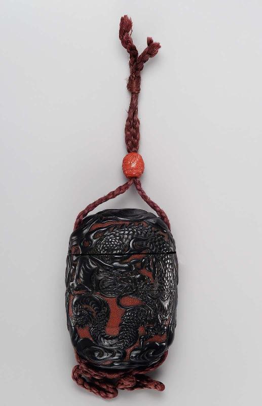 Three-case inro with dragon and tiger designs
