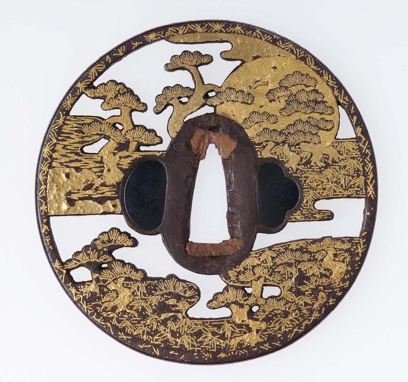 Tsuba with design of pine trees and setting sun