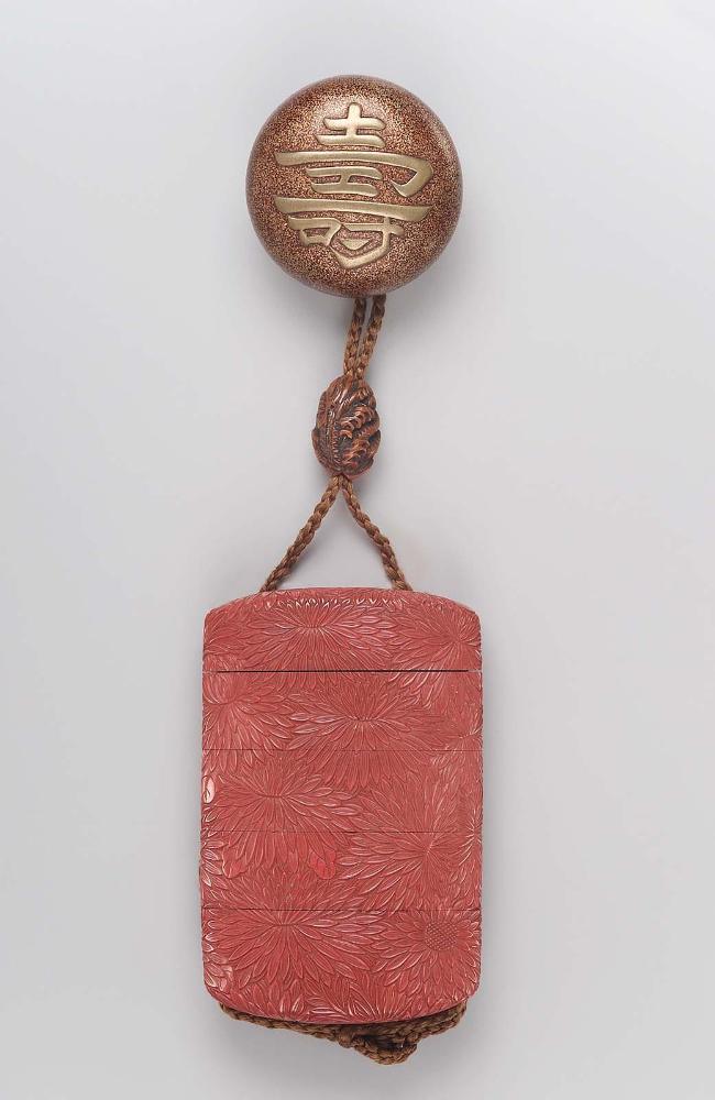 Manju netsuke with design of the character kotobuki