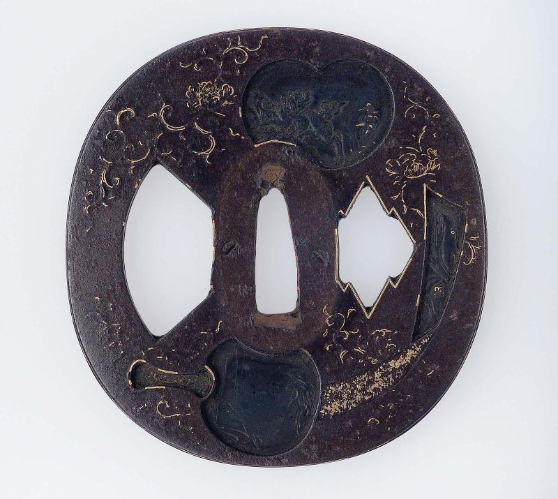 Tsuba with design of fan-shapes, poem-papers, books etc.