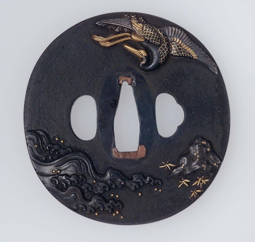 Tsuba with design of crane, rock and waves