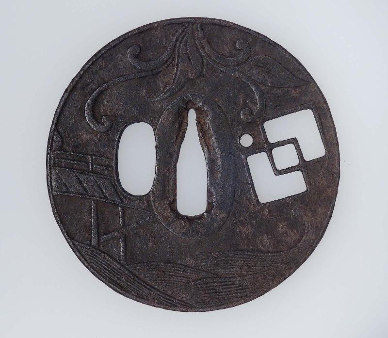 Tsuba with design of grasses, bridge, cloud and waves