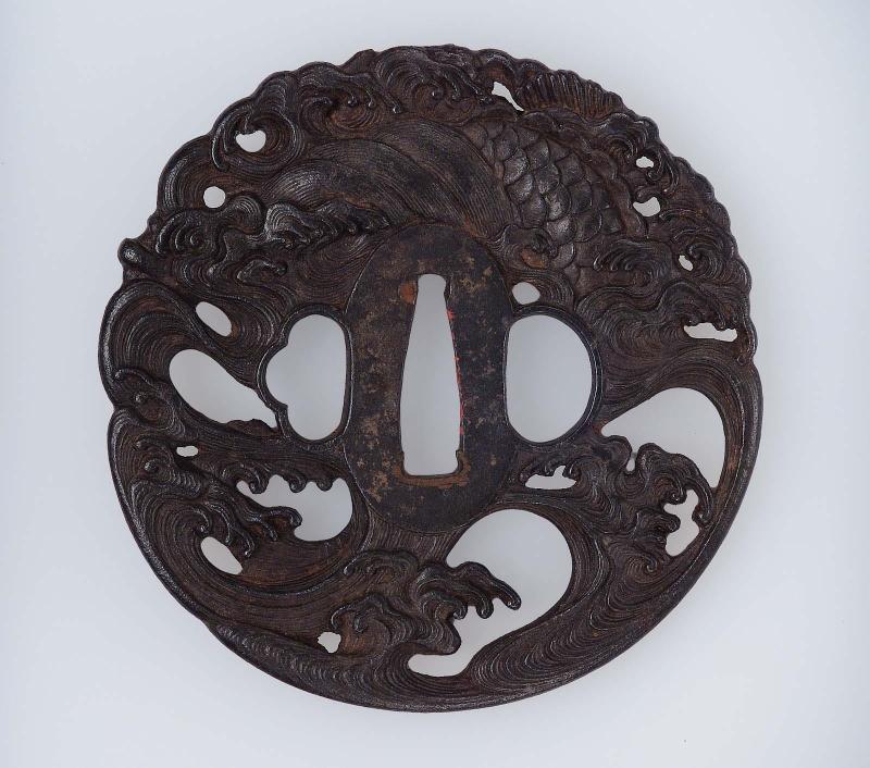 Tsuba with design of dragon and waves