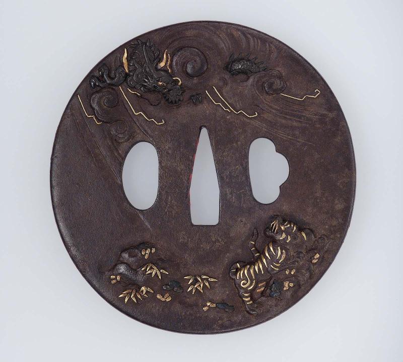 Tsuba with design of dragon, tiger and bamboo