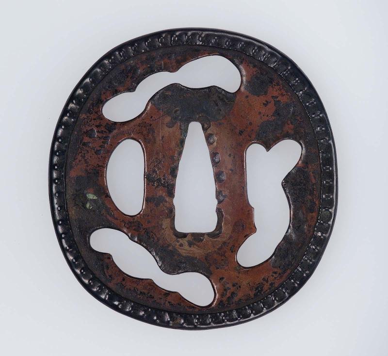 Tsuba with irregular openings