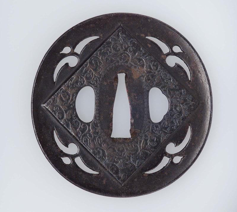 Tsuba with design of gulls, with a raised panel of floral decoration