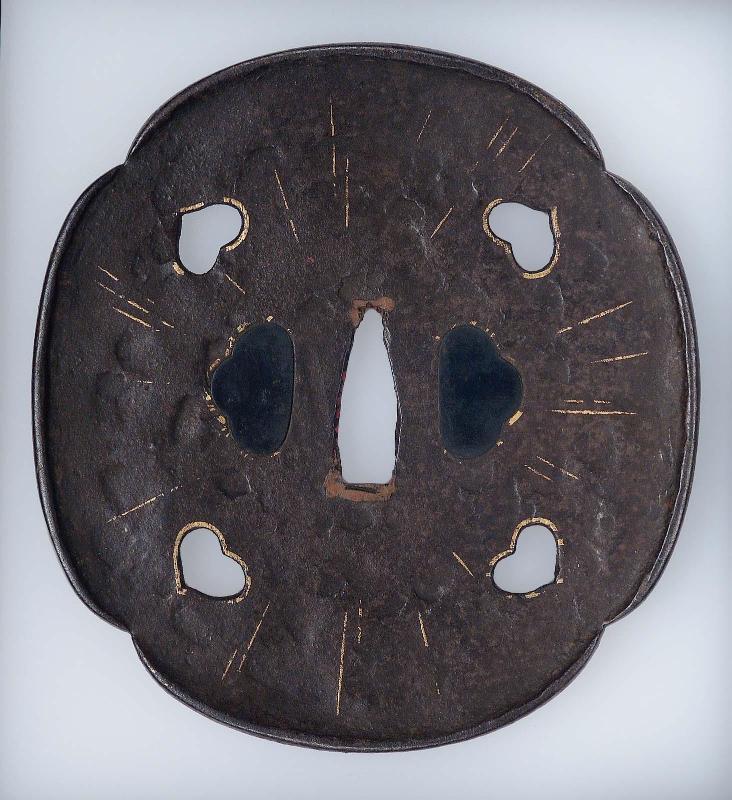 Tsuba with design of inome piercings and radiating lines