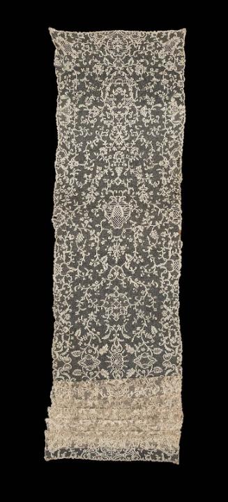 A long rectangular bobbin lace shawl