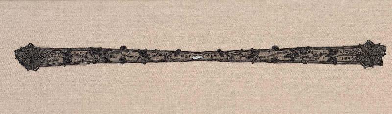A tie of black bobbin lace