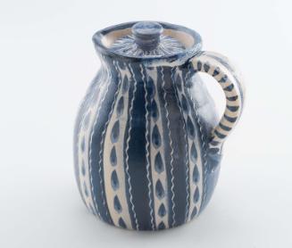 Raindrop covered pitcher with lid