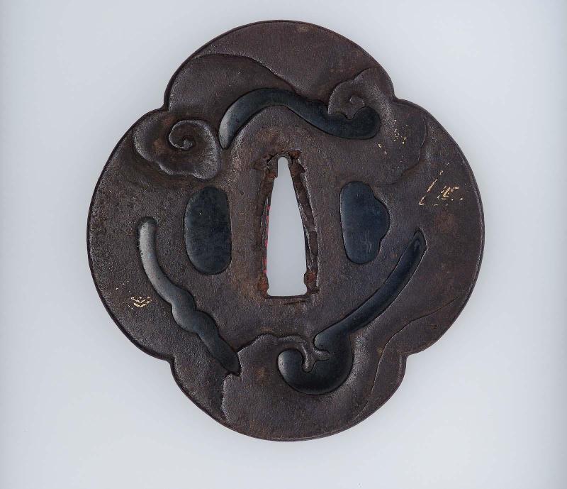 Tsuba with design of stylized clouds and lightning